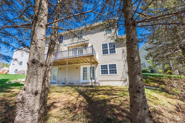 back of property with a wooden deck