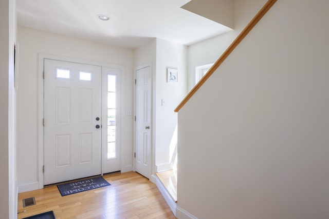 entryway featuring plenty of natural light, recessed lighting, light wood-style flooring, and visible vents