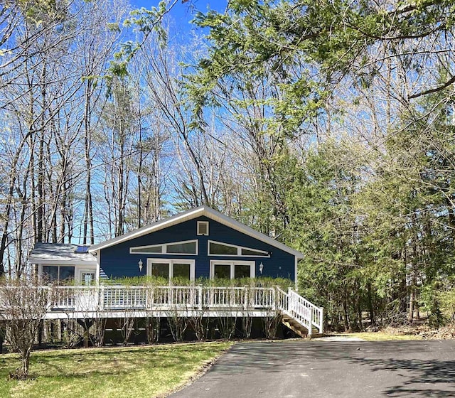 rustic home featuring a wooden deck