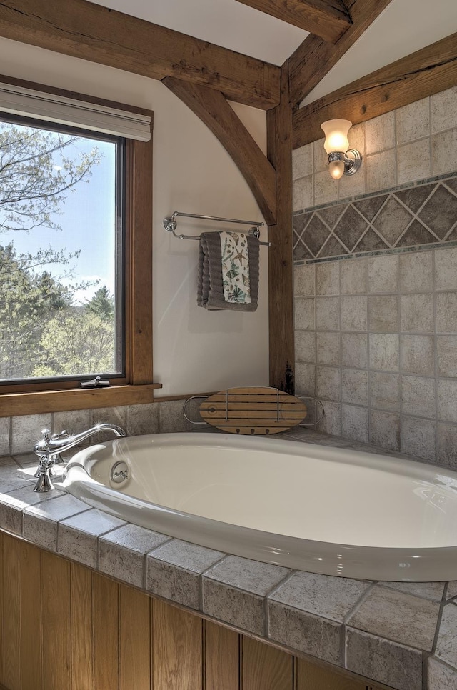 bathroom with a tub to relax in