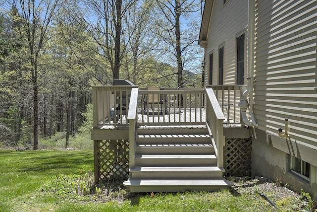 wooden deck with a yard