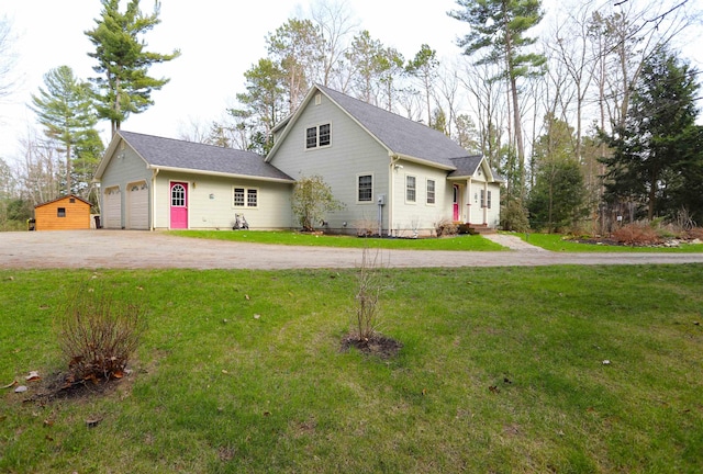 view of front of house with asphalt driveway, a front lawn, an attached garage, and roof with shingles