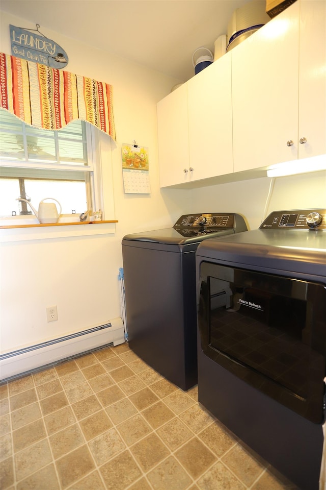 laundry area with cabinet space, washer and clothes dryer, and a baseboard radiator