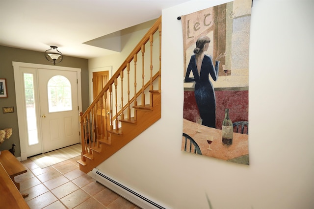 foyer entrance with stairs and tile patterned flooring
