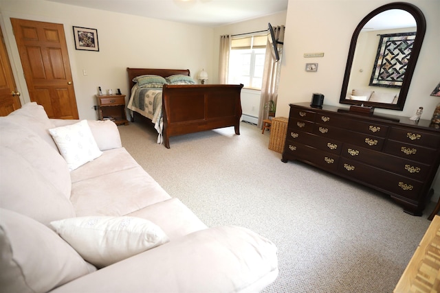 bedroom with carpet floors and baseboard heating