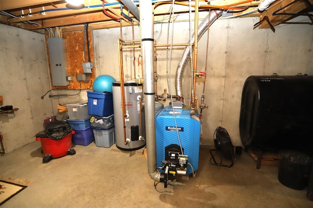 utility room featuring electric panel, water heater, heating fuel, and a heating unit