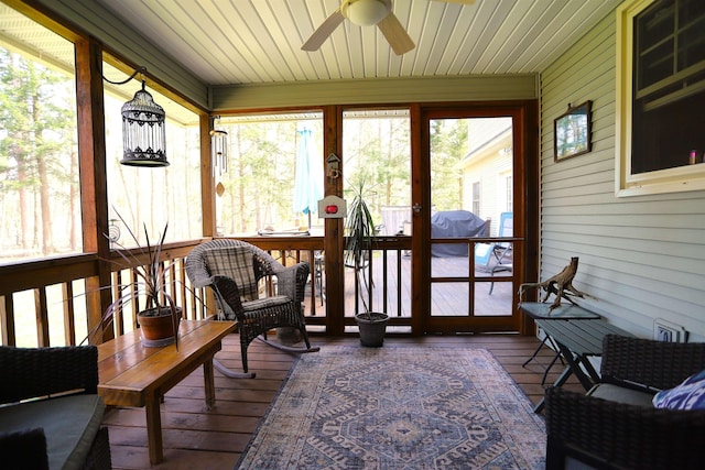 sunroom / solarium with ceiling fan and healthy amount of natural light