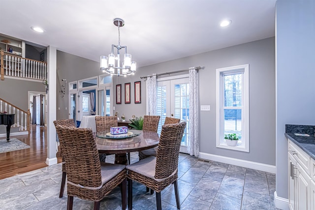 dining space featuring baseboards, stairway, recessed lighting, french doors, and a notable chandelier