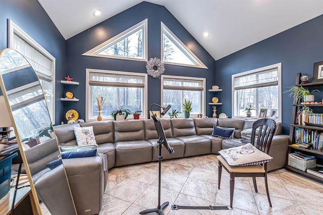 living area featuring recessed lighting and high vaulted ceiling
