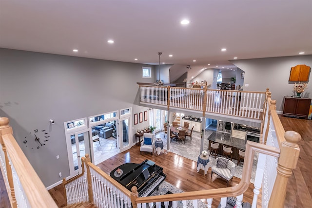 living room featuring recessed lighting, baseboards, and wood finished floors