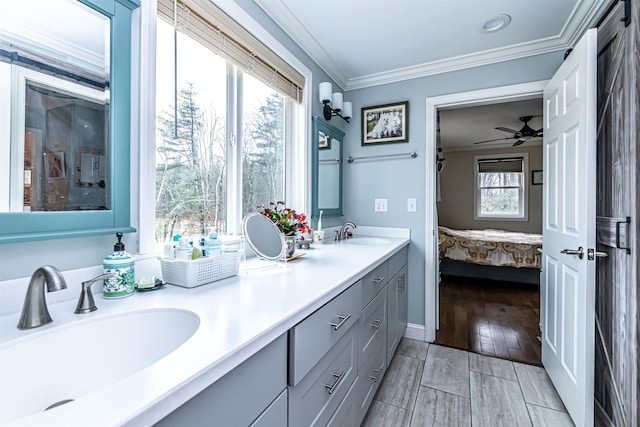 full bath featuring crown molding, a sink, ensuite bathroom, and wood finished floors