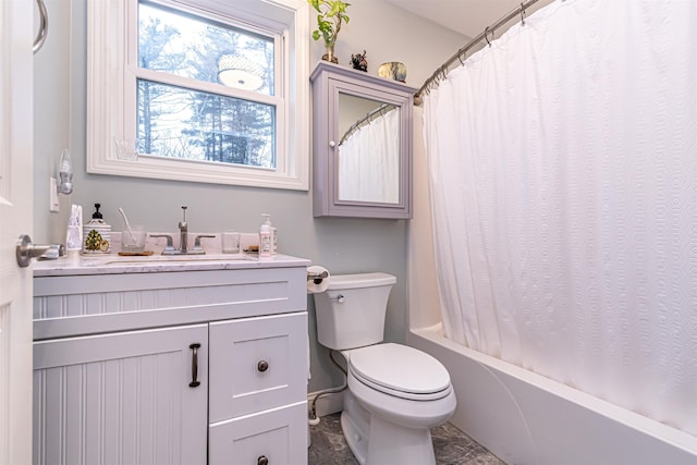 full bath with vanity, shower / bath combo, and toilet