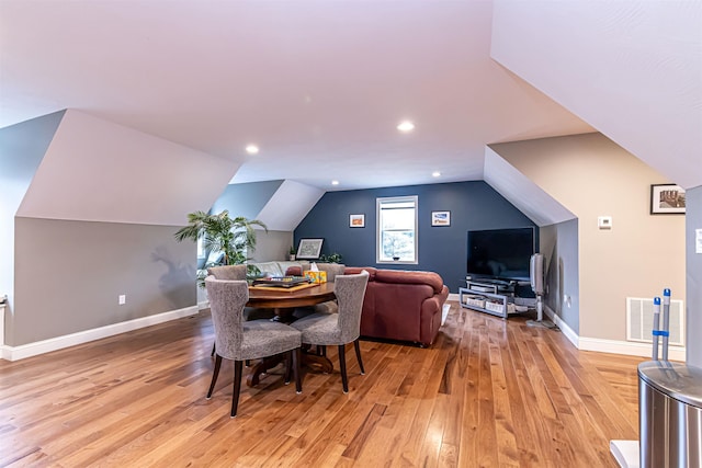 dining space with visible vents, vaulted ceiling, baseboards, recessed lighting, and light wood-style flooring
