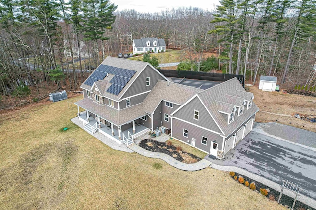 birds eye view of property with a forest view
