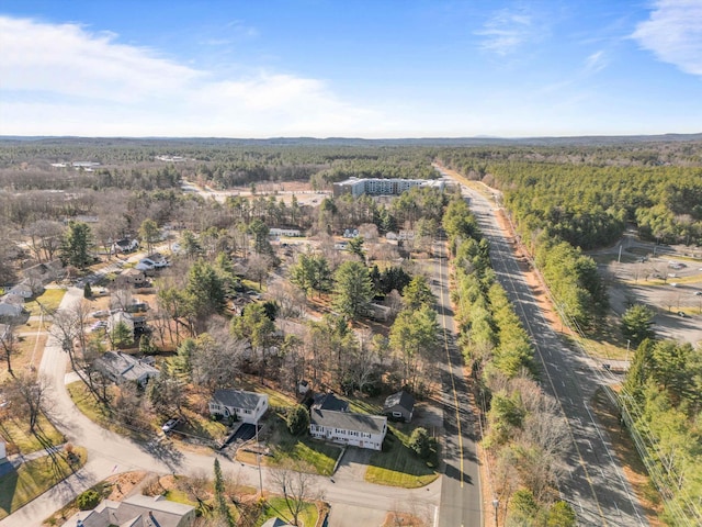 bird's eye view featuring a forest view
