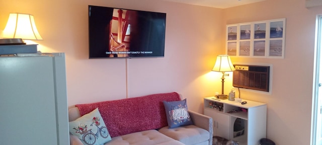 sitting room featuring a wall mounted AC
