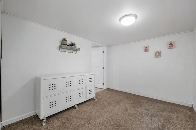 unfurnished bedroom featuring baseboards and carpet