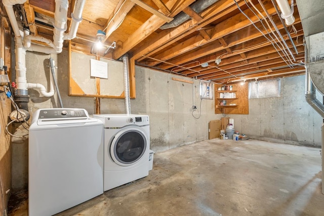 below grade area with washer and clothes dryer