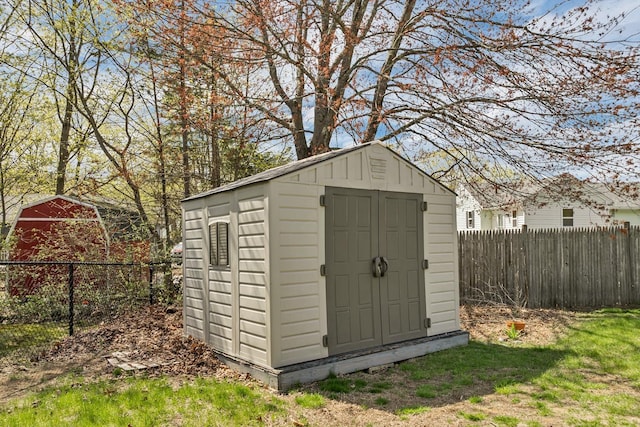 view of shed featuring a fenced backyard