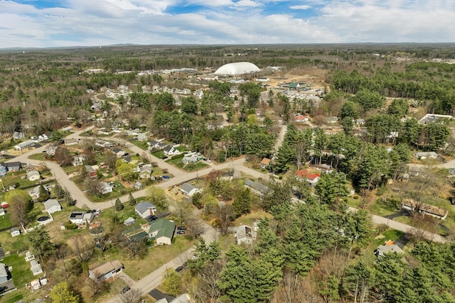 bird's eye view featuring a wooded view