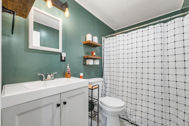 bathroom with vanity, toilet, and a shower with shower curtain
