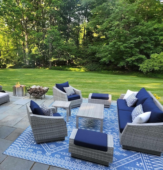 view of patio / terrace featuring an outdoor living space with a fire pit