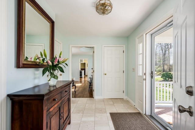 foyer entrance with baseboards