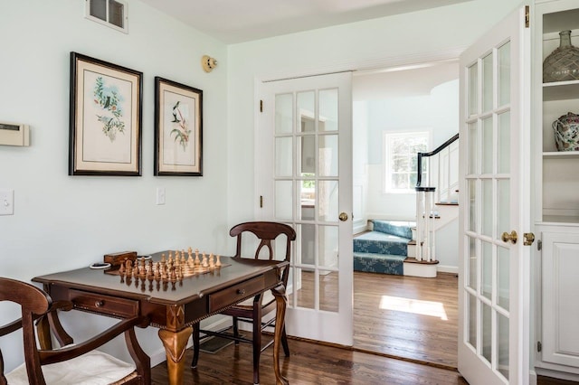 interior space featuring visible vents, dark wood-style floors, french doors, and stairway