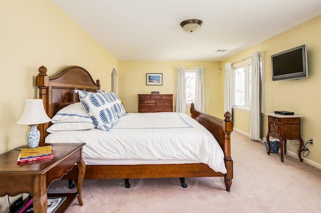 carpeted bedroom with baseboards