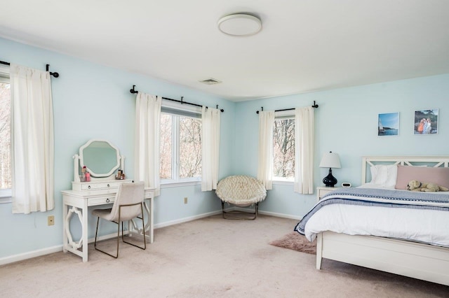 bedroom featuring visible vents, carpet, and baseboards