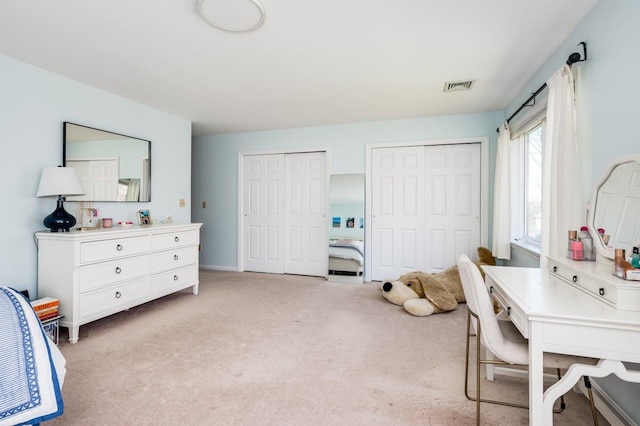 office with light colored carpet and visible vents