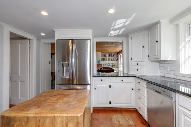 kitchen featuring recessed lighting, appliances with stainless steel finishes, and white cabinets