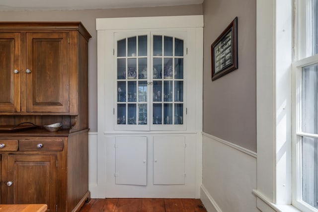 doorway featuring baseboards