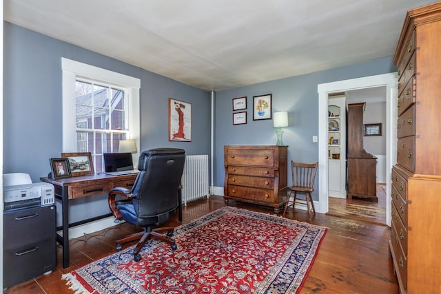 office space featuring radiator heating unit and wood finished floors