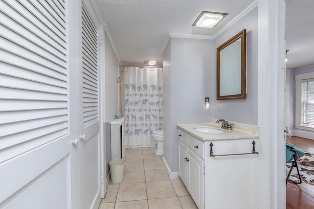 bathroom with vanity, toilet, tile patterned floors, a shower with curtain, and ornamental molding