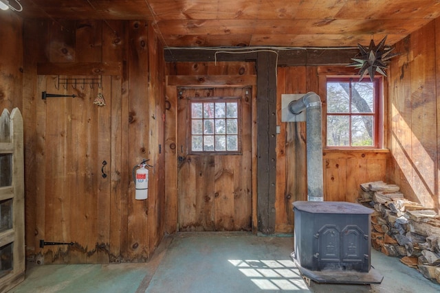 interior space with plenty of natural light and wood walls