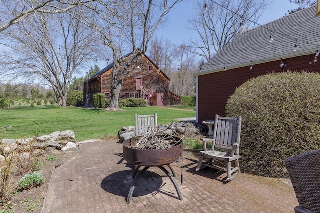 view of patio with a fire pit