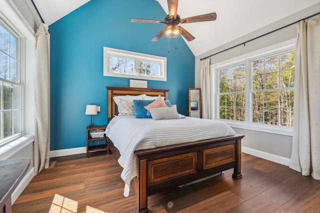 bedroom featuring ceiling fan, baseboards, vaulted ceiling, and wood finished floors