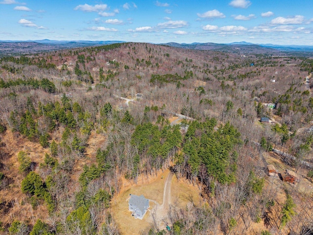 aerial view with a mountain view and a wooded view