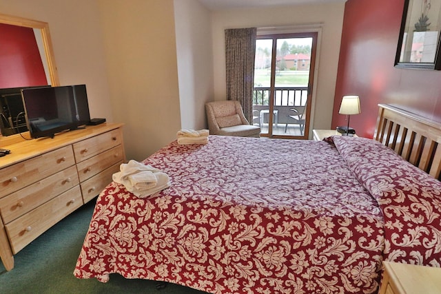 bedroom with carpet flooring and access to exterior