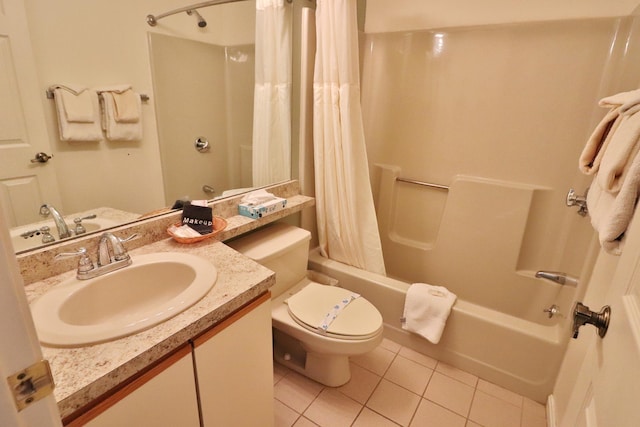 bathroom featuring tile patterned floors, shower / bath combo with shower curtain, vanity, and toilet