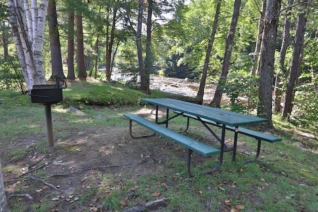 view of community featuring a forest view