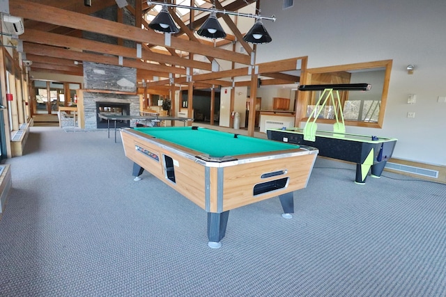 rec room featuring an outdoor stone fireplace, pool table, carpet, and high vaulted ceiling