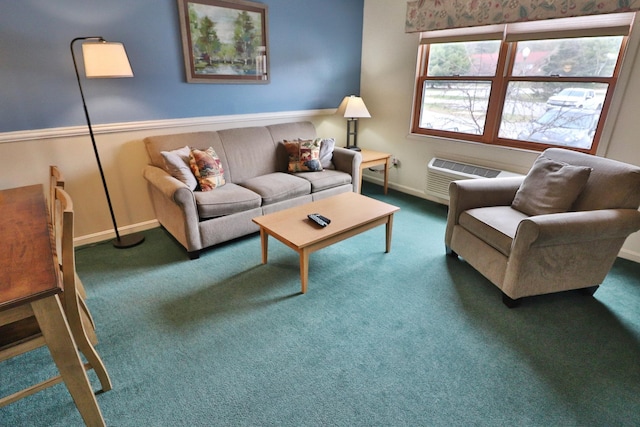 living area featuring carpet, baseboards, and a wall mounted AC