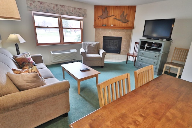 carpeted living area with a fireplace and a wall mounted AC