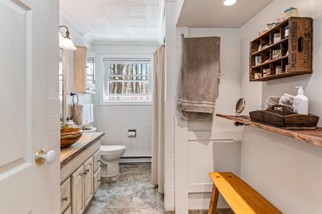 full bathroom featuring vanity, crown molding, toilet, a shower with curtain, and stone finish flooring