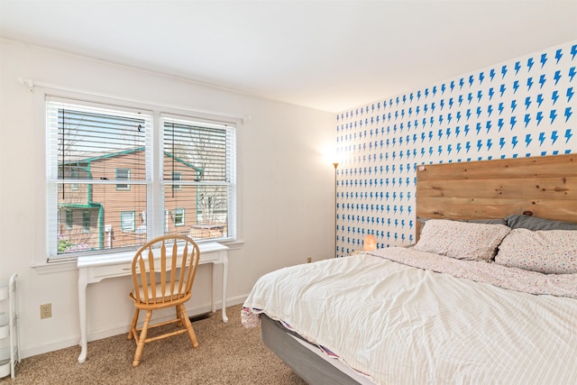bedroom with baseboards and carpet floors