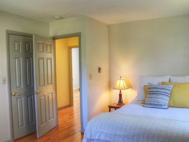 bedroom featuring wood finished floors