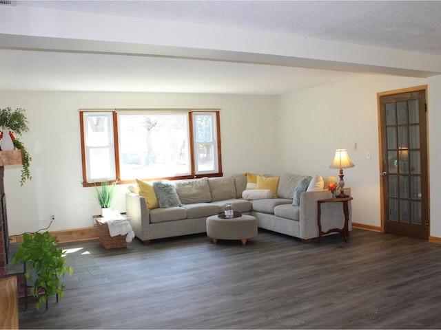 living area with baseboards and dark wood finished floors