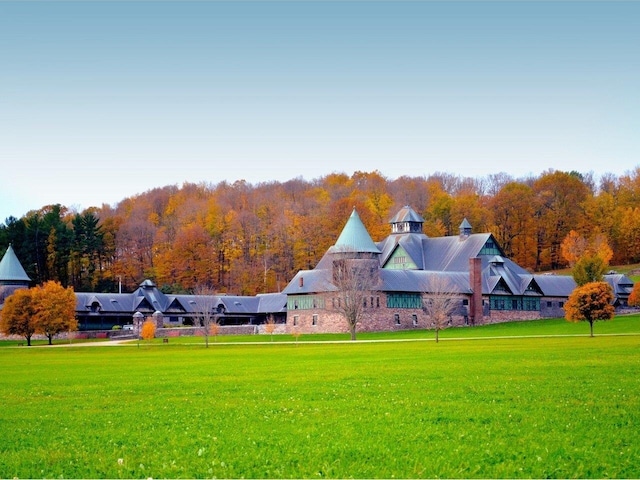 exterior space featuring a wooded view